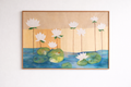 Framed artwork of water lilies on a beige background