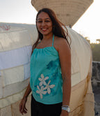 Teal sleeveless cotton top with floral detail, comfortable summer top for casual outings and travel.