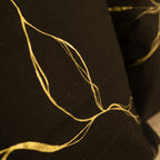 Black cotton cushion covers with abstract gold detailing, decorative pillow covers for sofa and contemporary interiors.