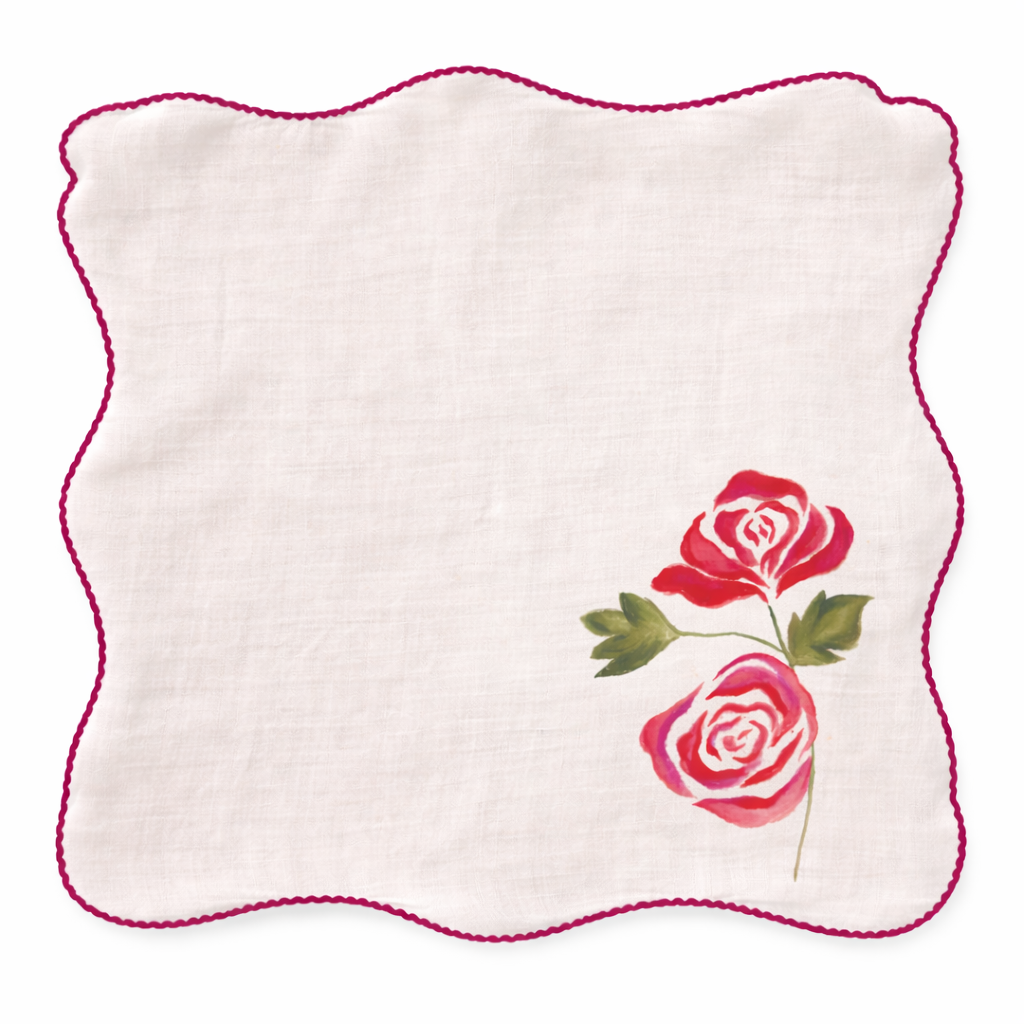 Decorative cotton table napkins featuring hand painted floral designs in orange, white and red tones, reusable cloth napkins for everyday dining and table styling