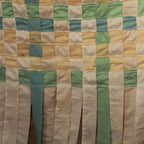 Decorative fabric curtain with handcrafted woven textile panel in beige, green, and blue tones, suitable for doors, windows, and interior spaces.