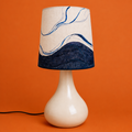 Lamp with a marbled design on an orange background