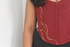 Red top with gold Painting on a plain background