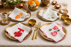 Reusable cotton dinner napkins with botanical floral illustrations and stitched scalloped borders, decorative napkins for dining table and home entertaining.