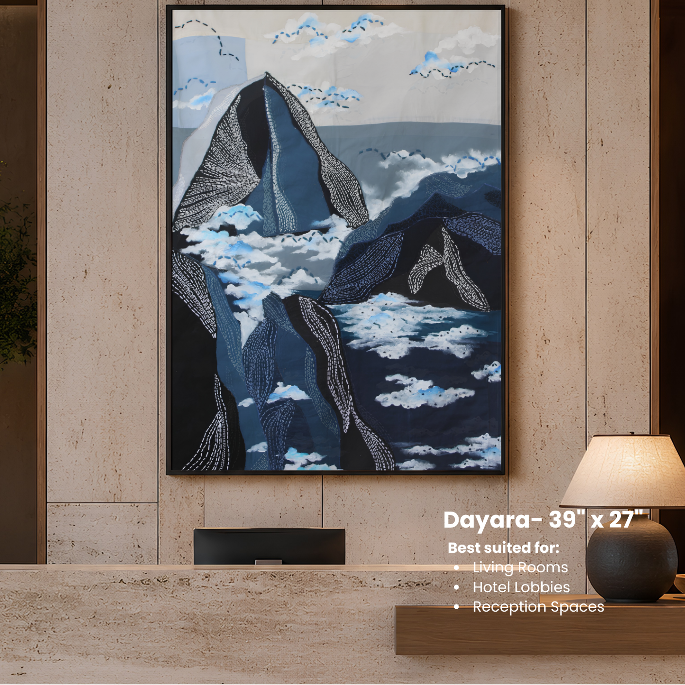 Framed artwork of mountains and clouds on a wall in a modern interior setting.