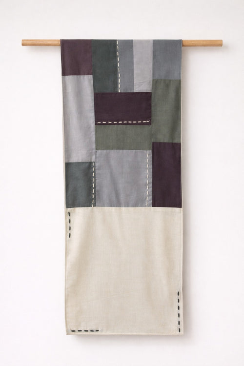 Handmade cotton patchwork table runner with neutral fabric panels and stitched detailing, table linen decor for dining tables and contemporary interiors.