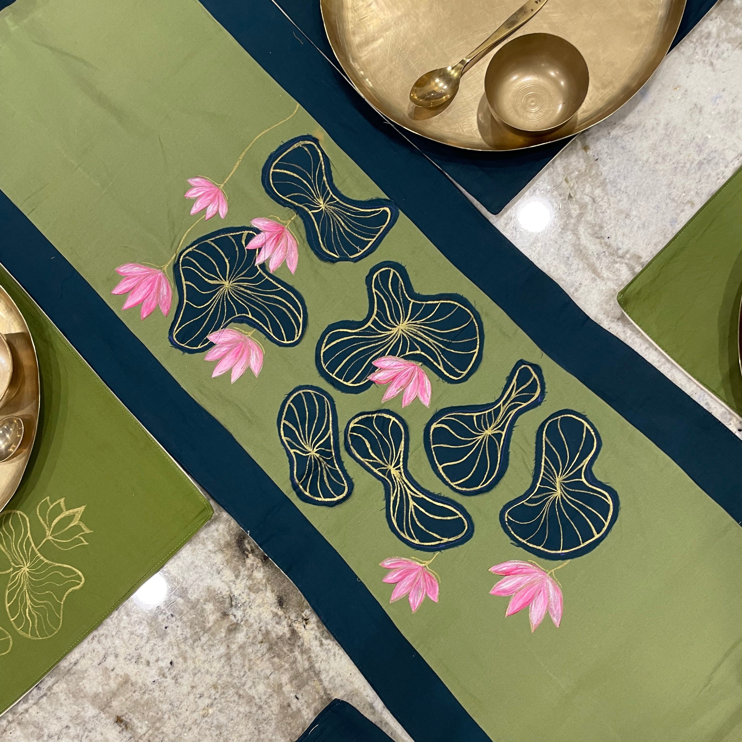 Decorative table runner with floral patterns on a table setting.