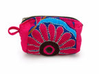 A small zippered pouch with a bright pink body and a colorful embroidered design featuring blue, pink, brown, and gold details, set against a plain white background.