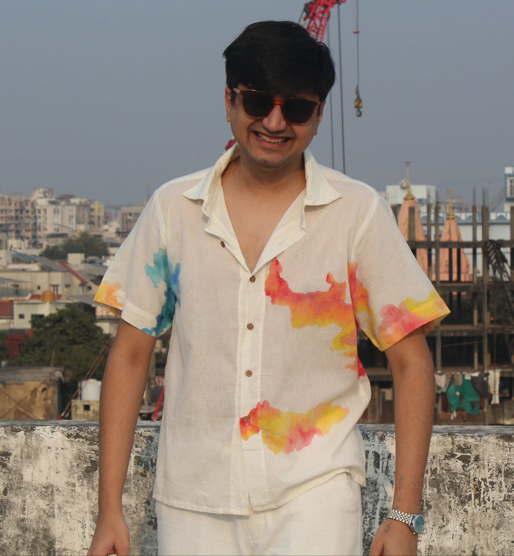 Relaxed fit men’s beach vacation shirt with hand painted colors, breathable summer shirt ideal for travel and holiday wear.