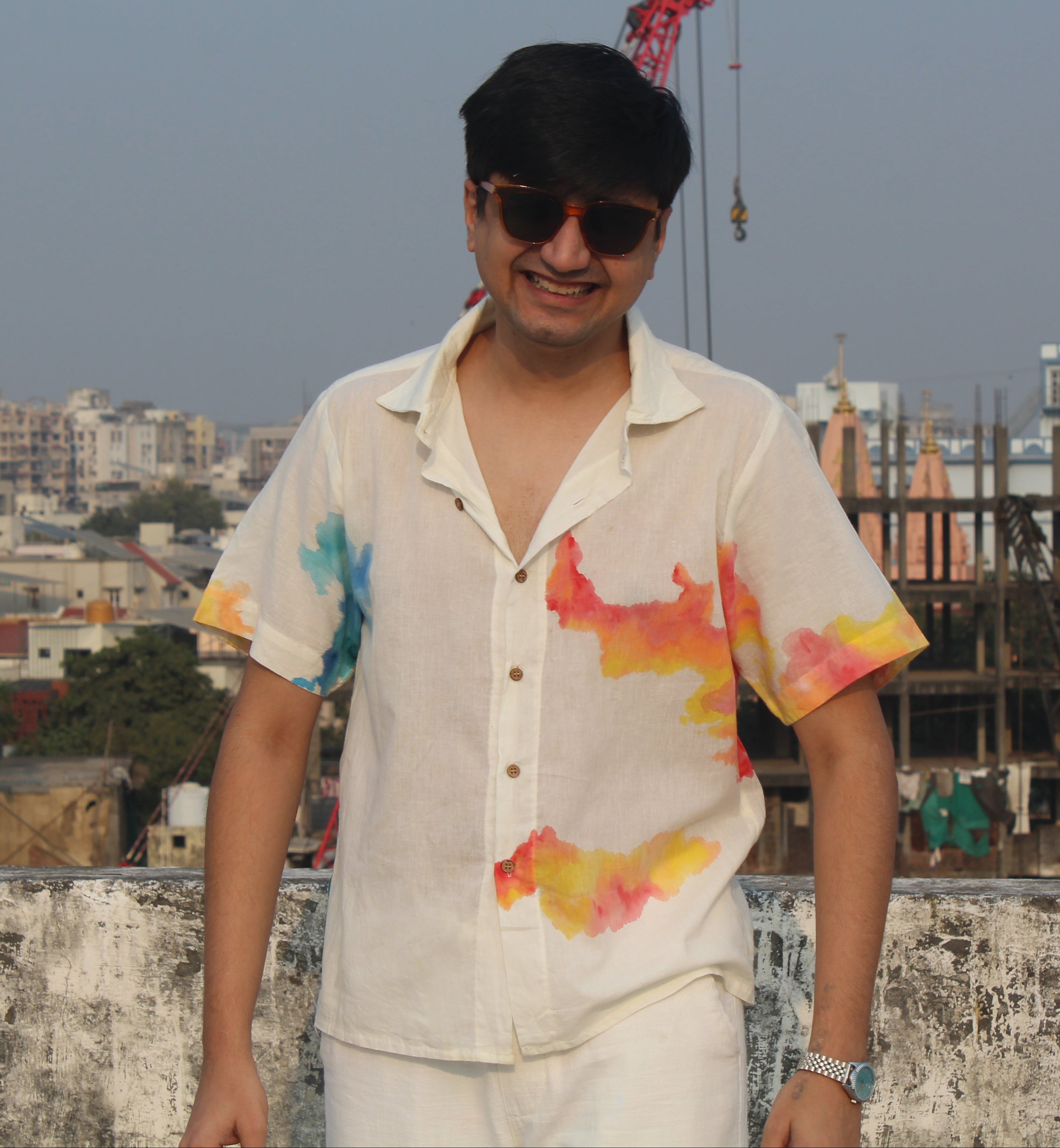 Relaxed fit men’s beach vacation shirt with hand painted colors, breathable summer shirt ideal for travel and holiday wear.