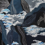 Kantha embroidery depicting mountains and cloud pattern on a dark background