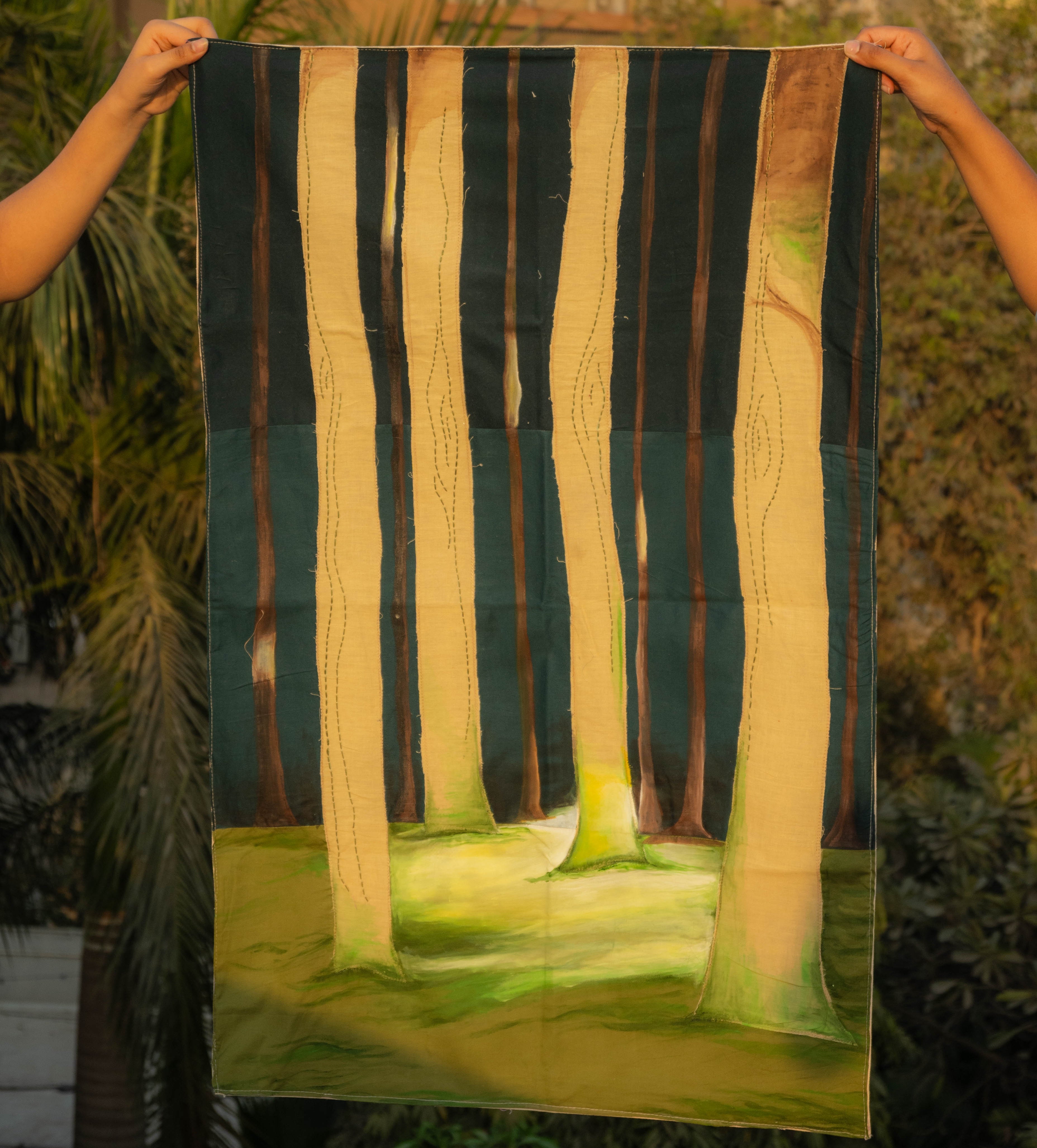 Hand painted textile wall art depicting a forest scene with tall trees and soft landscape tones, statement fabric wall decor for living rooms and studios.