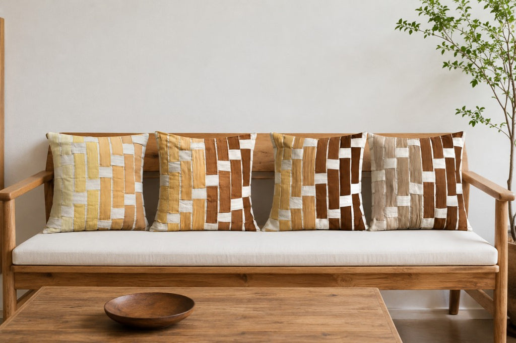 Wooden sofa with patterned cushions in a minimalistic room.