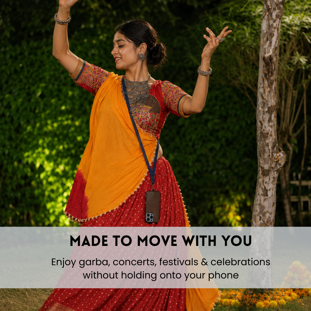 A woman in a traditional Indian outfit with a bright orange and red saree is dancing outdoors in a garden setting. A semi-transparent banner at the bottom reads 'MADE TO MOVE WITH YOU' and 'Enjoy garba, concerts, festivals & celebrations without holding onto your phone'.