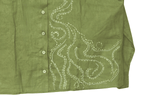 Green shirt with white embroidery on a white background