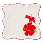 Reusable cotton table napkins with hand painted floral illustrations in orange, white and red tones, decorative cloth napkins for dining table styling.