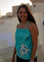 Sleeveless cotton summer top with floral accents, relaxed casual top for warm weather outfits.