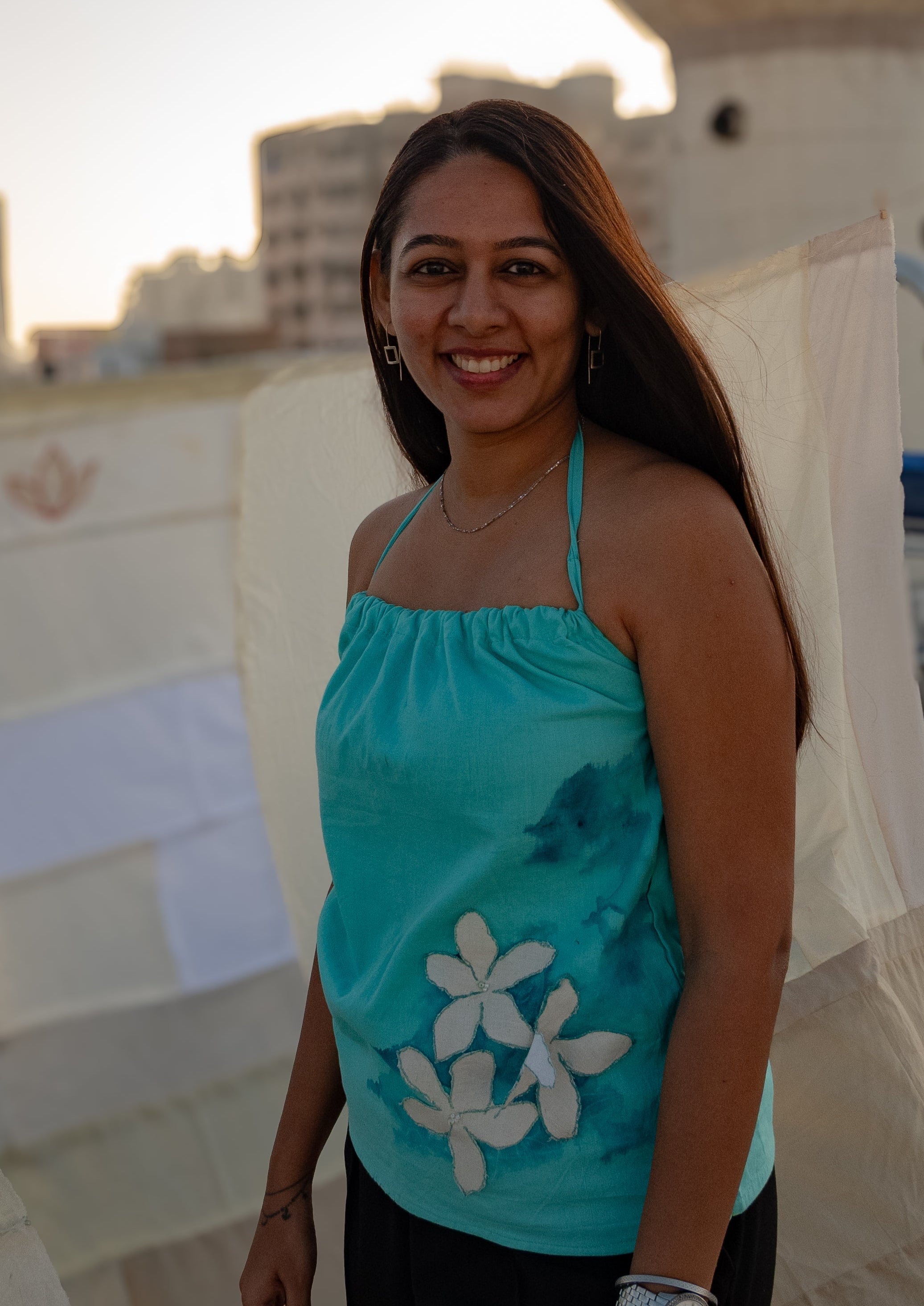 Sleeveless cotton summer top with floral accents, relaxed casual top for warm weather outfits.