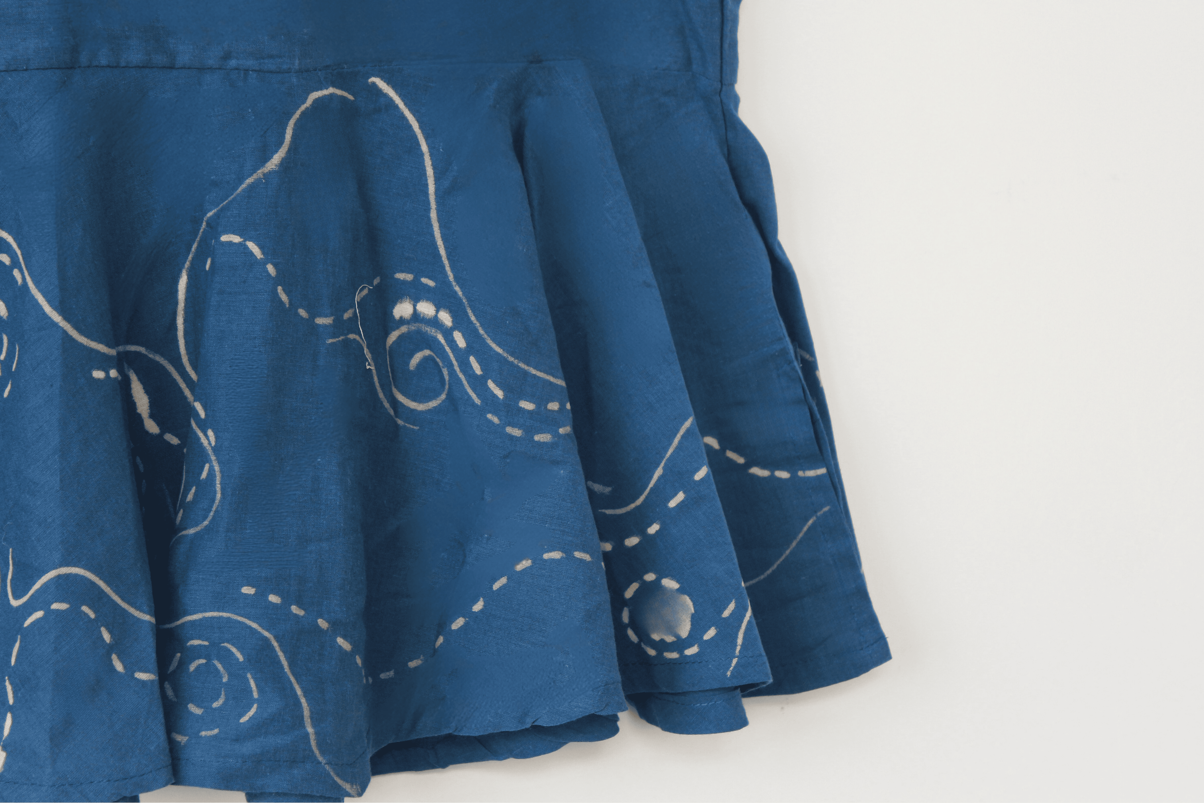 Blue cotton halter summer top inspired by the flowing movement of starry night, featuring stitched swirl detailing and a relaxed silhouette for warm weather outfits.