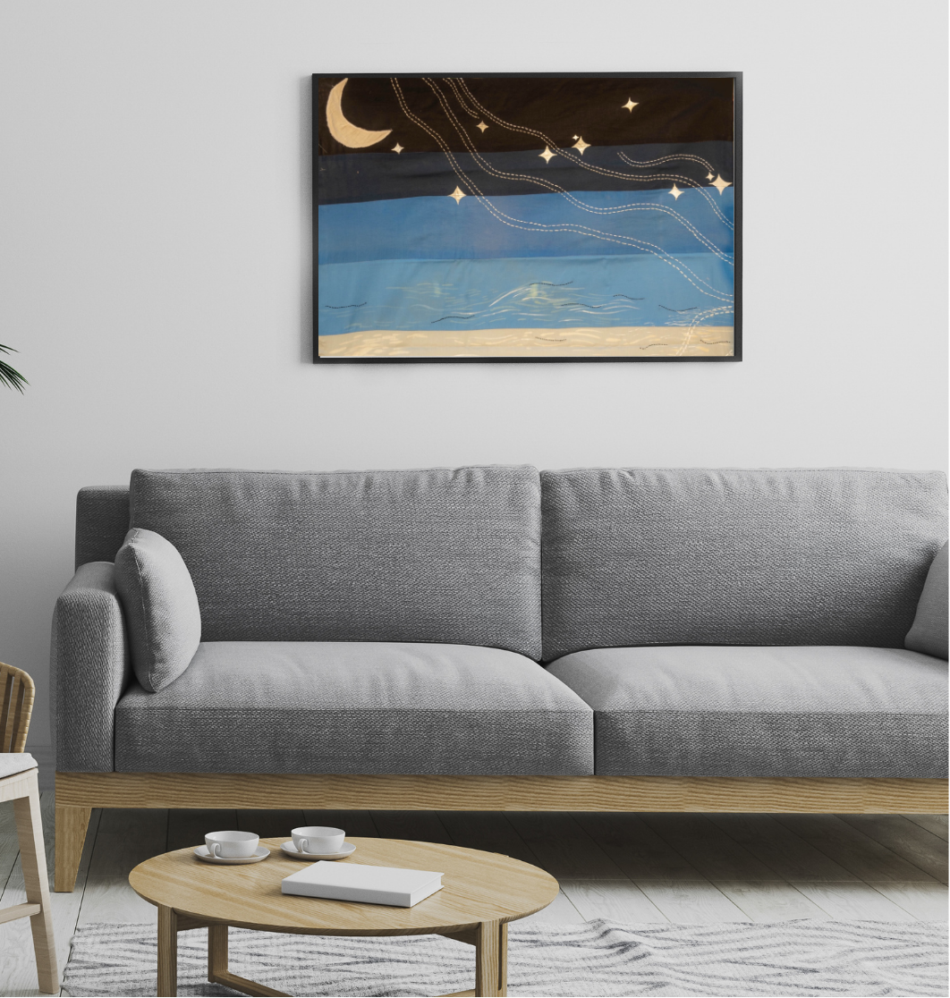 Textile wall art featuring hand painted night sky with moon and stars, detailed with kantha embroidery on fabric, modern wall decor for living room interiors.