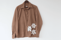 Ocassion wear beige shirt with white floral patterns with beaded details