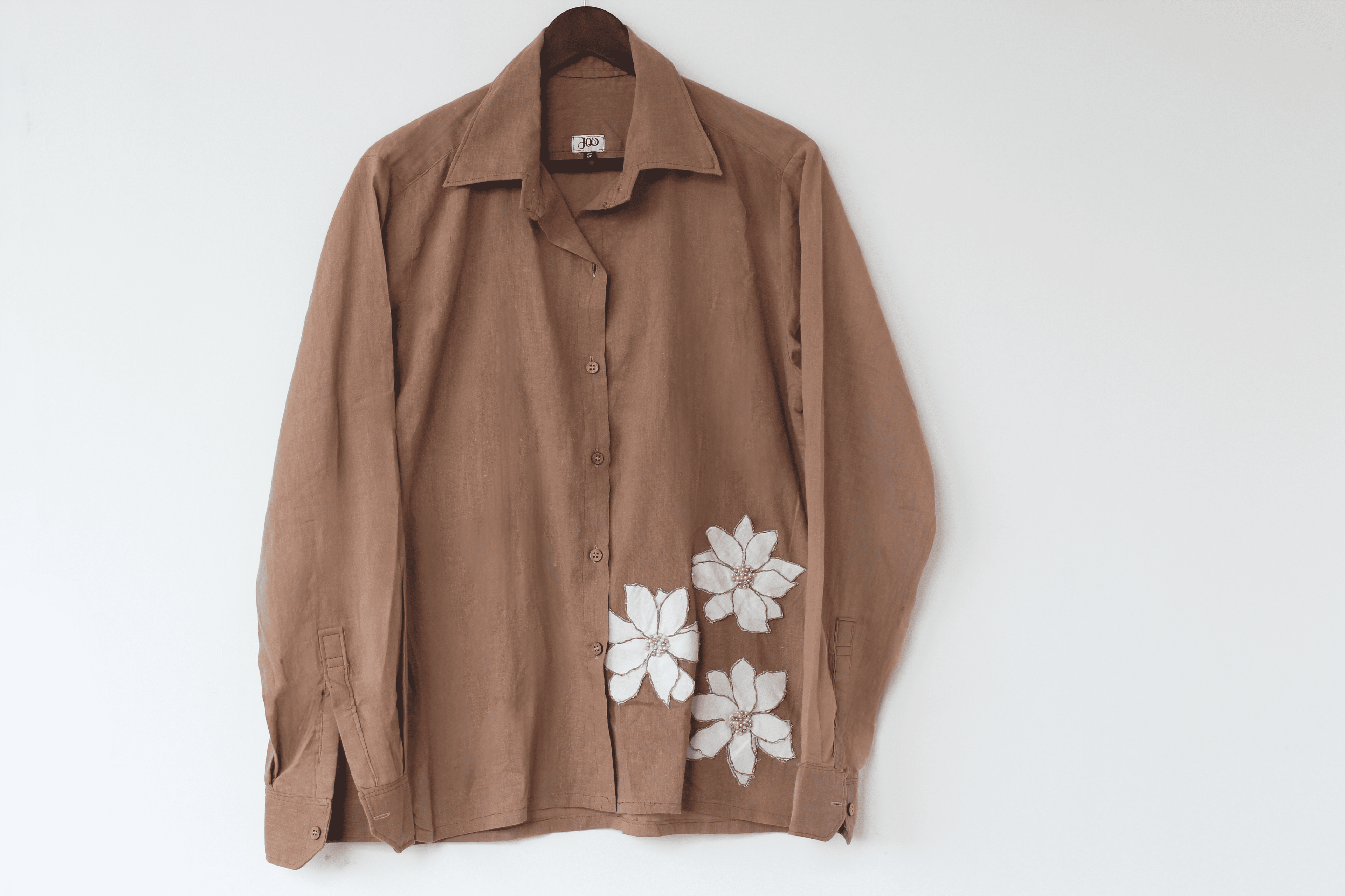 Ocassion wear beige shirt with white floral patterns with beaded details