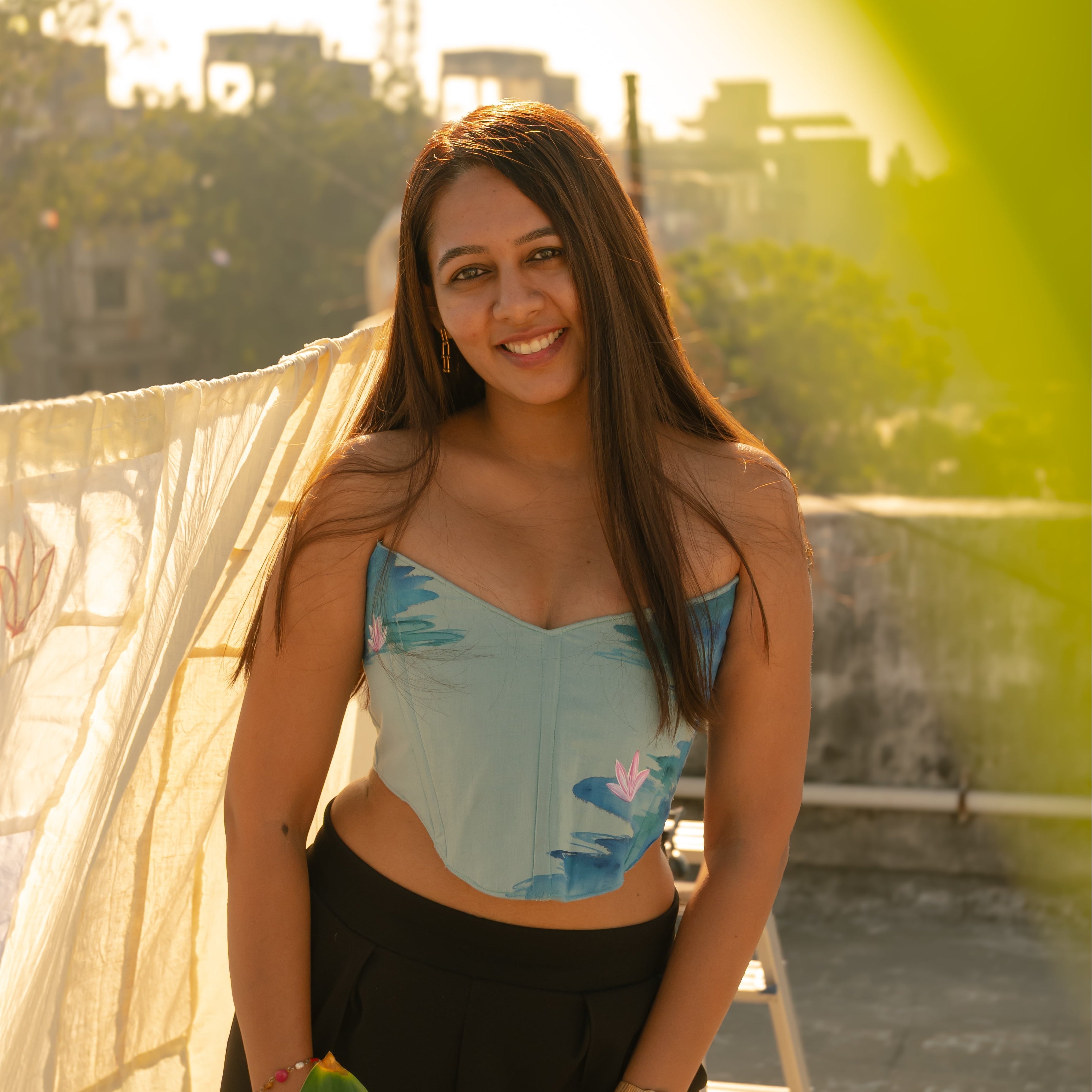 Woman wearing an adjustable cotton corset top with structured fit and artistic detailing, stylish corset top for party and evening wear.