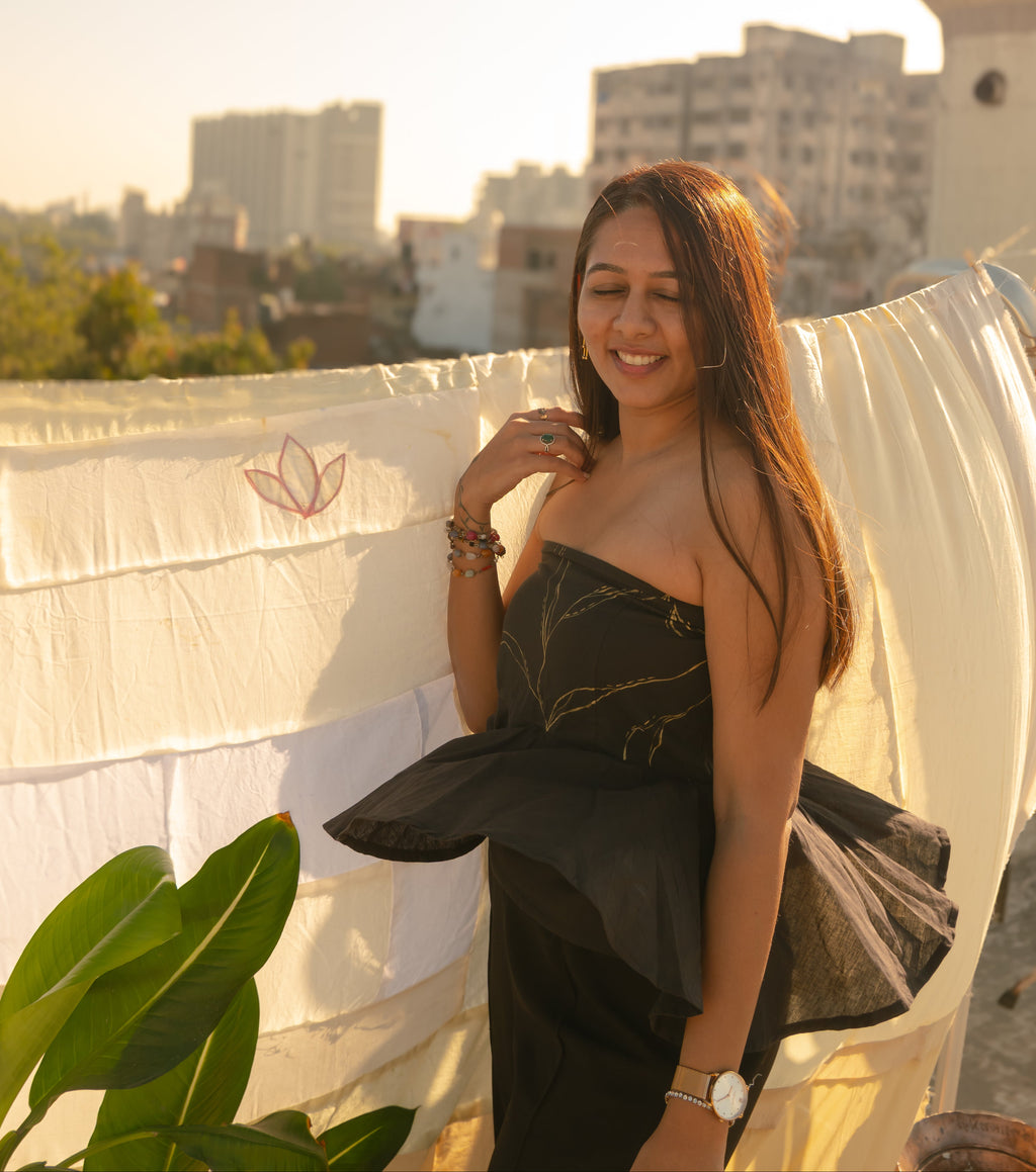 Woman wearing an elegant strapless evening Tube Top  with subtle handcrafted detail, perfect party dress for women.