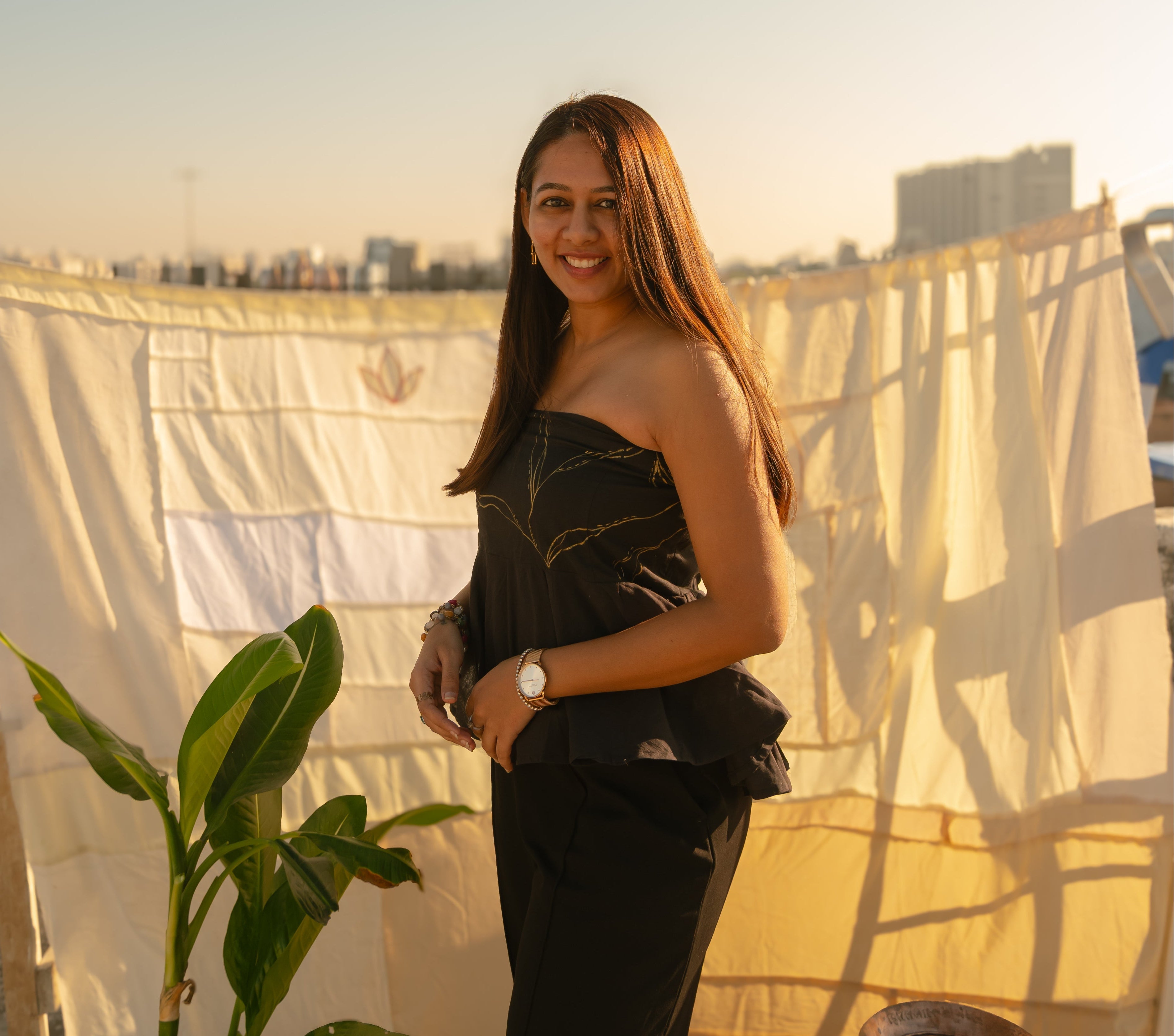 Woman wearing a strapless party wear dress with elegant detailing, stylish evening dress for women perfect for parties and special occasions.