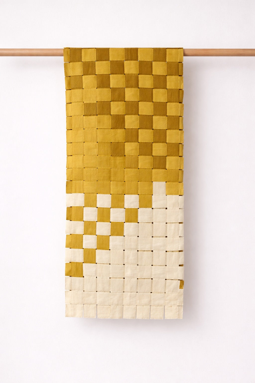 Handmade woven cotton table runner featuring a geometric square weave pattern, decorative table linen for dining table styling.