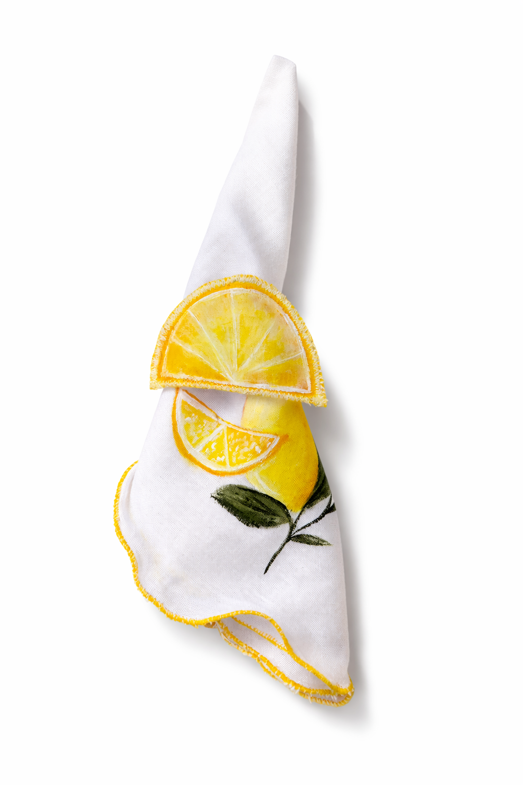 White napkin with lemon design napkin holder on a white background